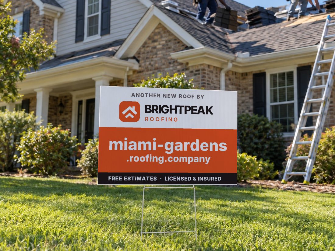 miami-gardens.roofing.company on a yard sign in front of a house getting a new roof